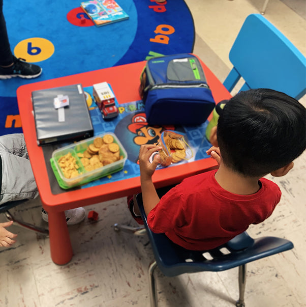 Children eating on a children’s table